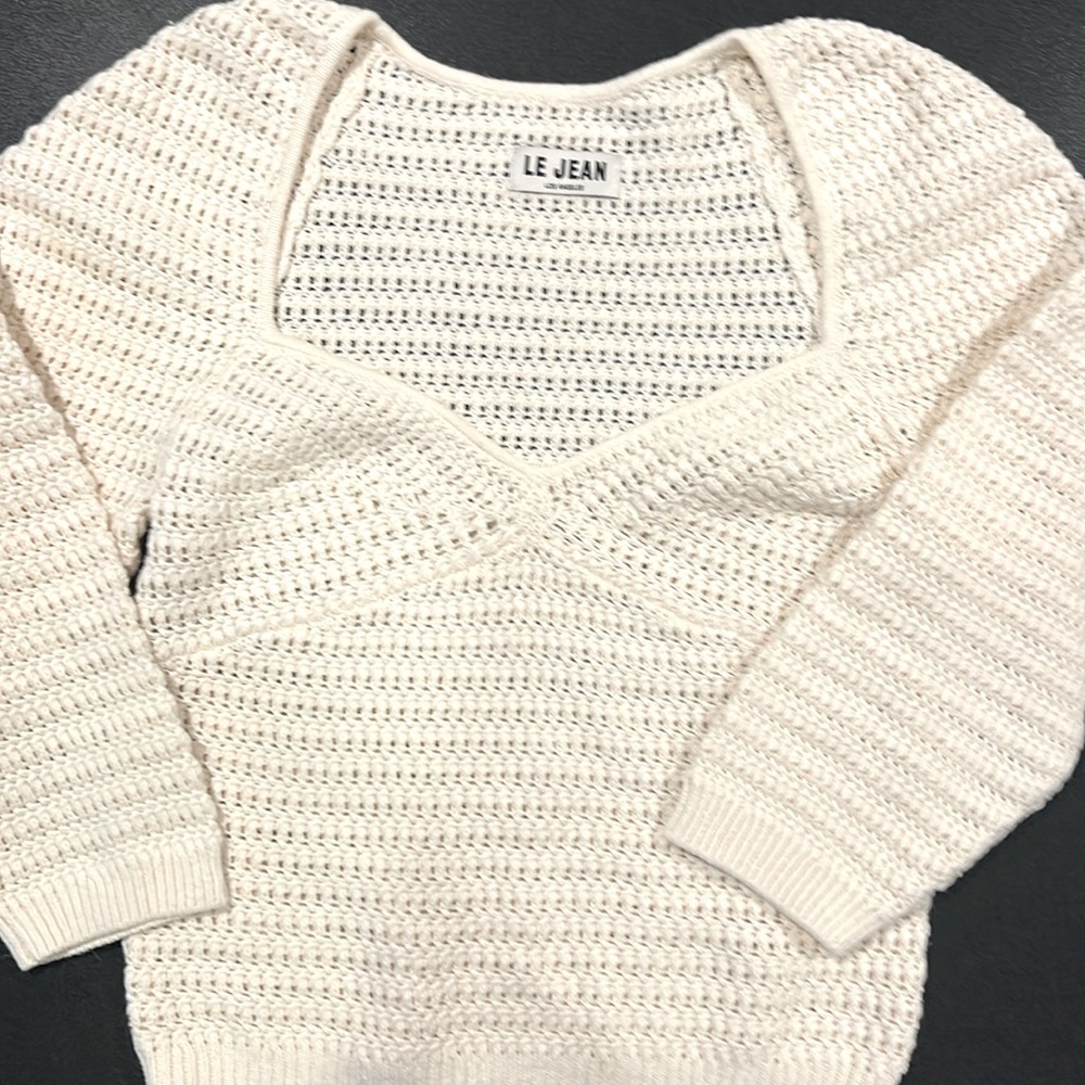 Cream sweater by Le Jean.  3/4 sleeves and classic shape.  Great with jeans.